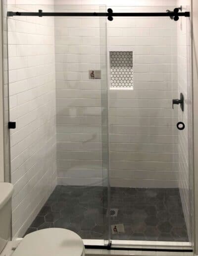 Barn door style glass shower door